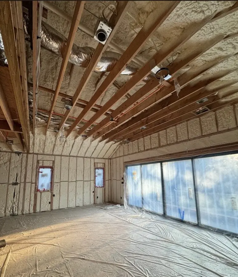 Interior walls and ceiling insulated with spray foam during new construction in North Riverside